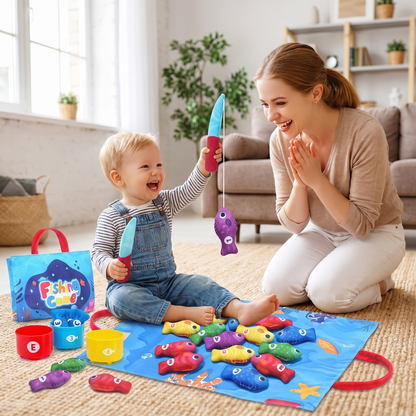 Toddler catching a plush fish with the fabric fishing rod while a parent cheers